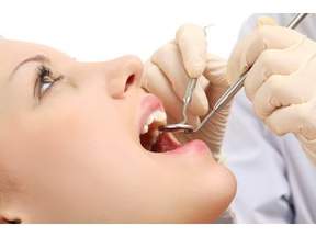 dental hygienist working on a patient