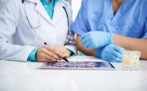 Two dentists review a case study for their group