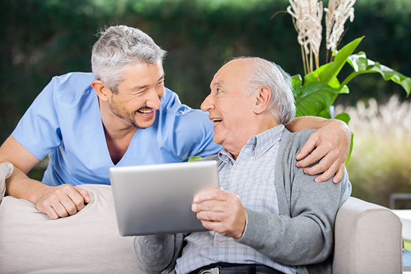 nurse helping a older man with financing options